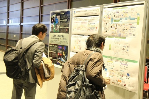 Participants reading research posters.