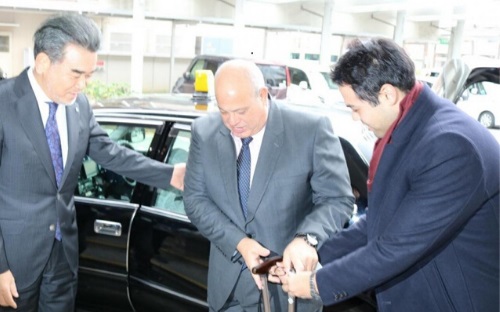 President Ochi (left) welcoming Mr. Rashwan (center)