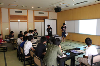 Students giving a research presentation at the residential program