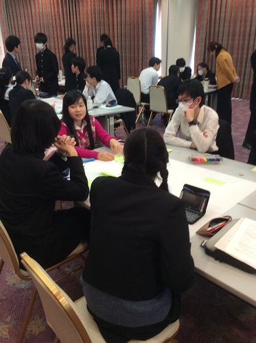 High School Students Discussing with an International Student