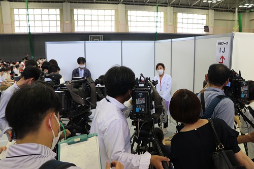 Dr. Okamoto, Director of the Health Service Center, interviewed by the press