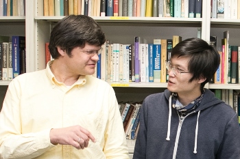 Associate Professor Hofmann talking with one of his students